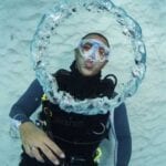 scuba-diver-blowing-bubble-rings-underwater